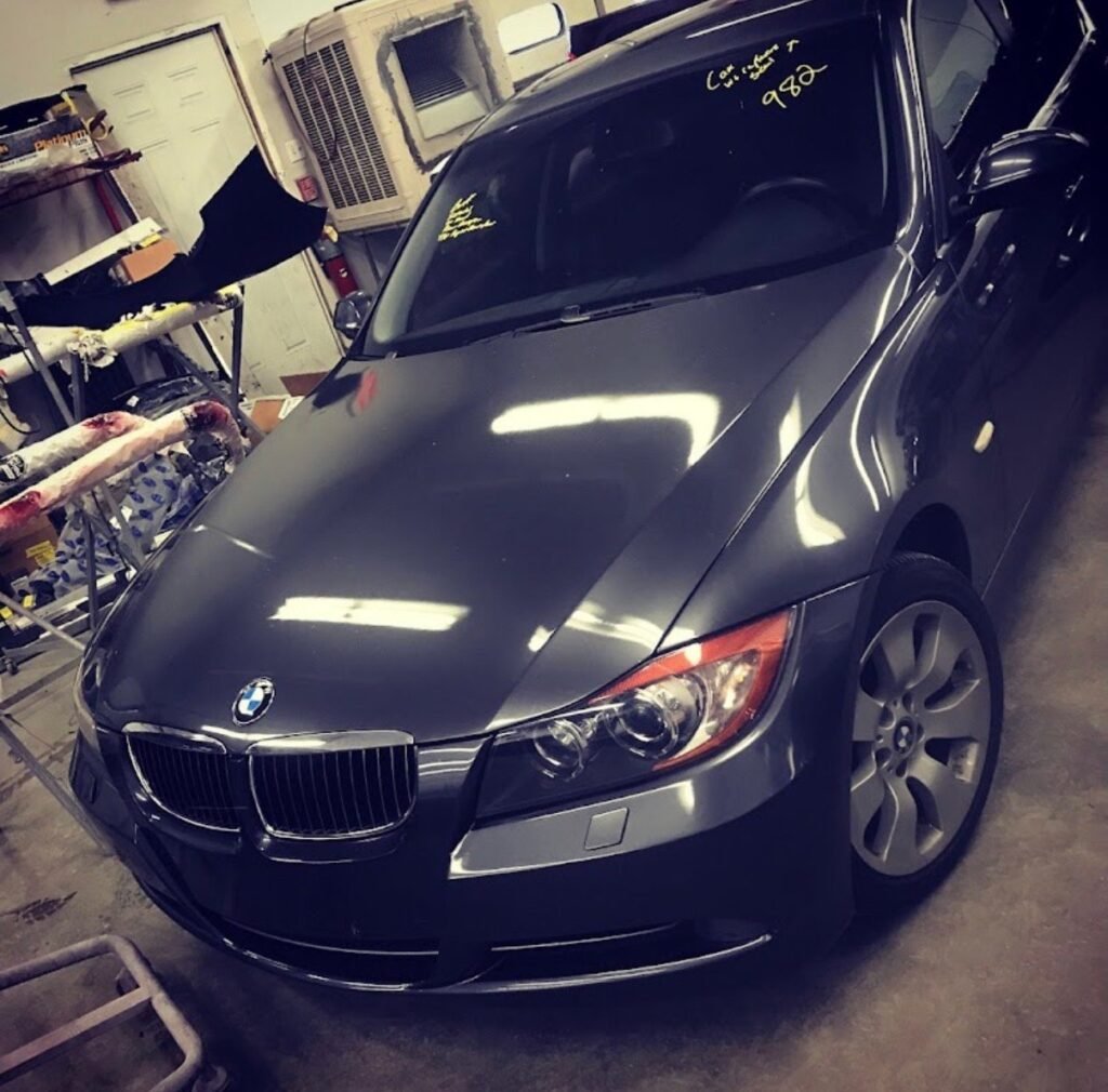 Grey BMW 3 Series cleaned and detailed after auto body repair at Extreme Twist Collision in Santa Fe, New Mexico